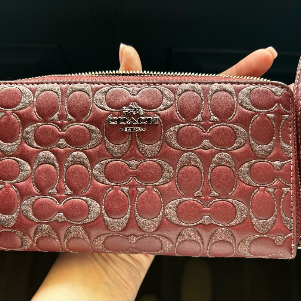 Coach Corner Zip Wristlet/Long Wallet in glitter signature leather, color wine.